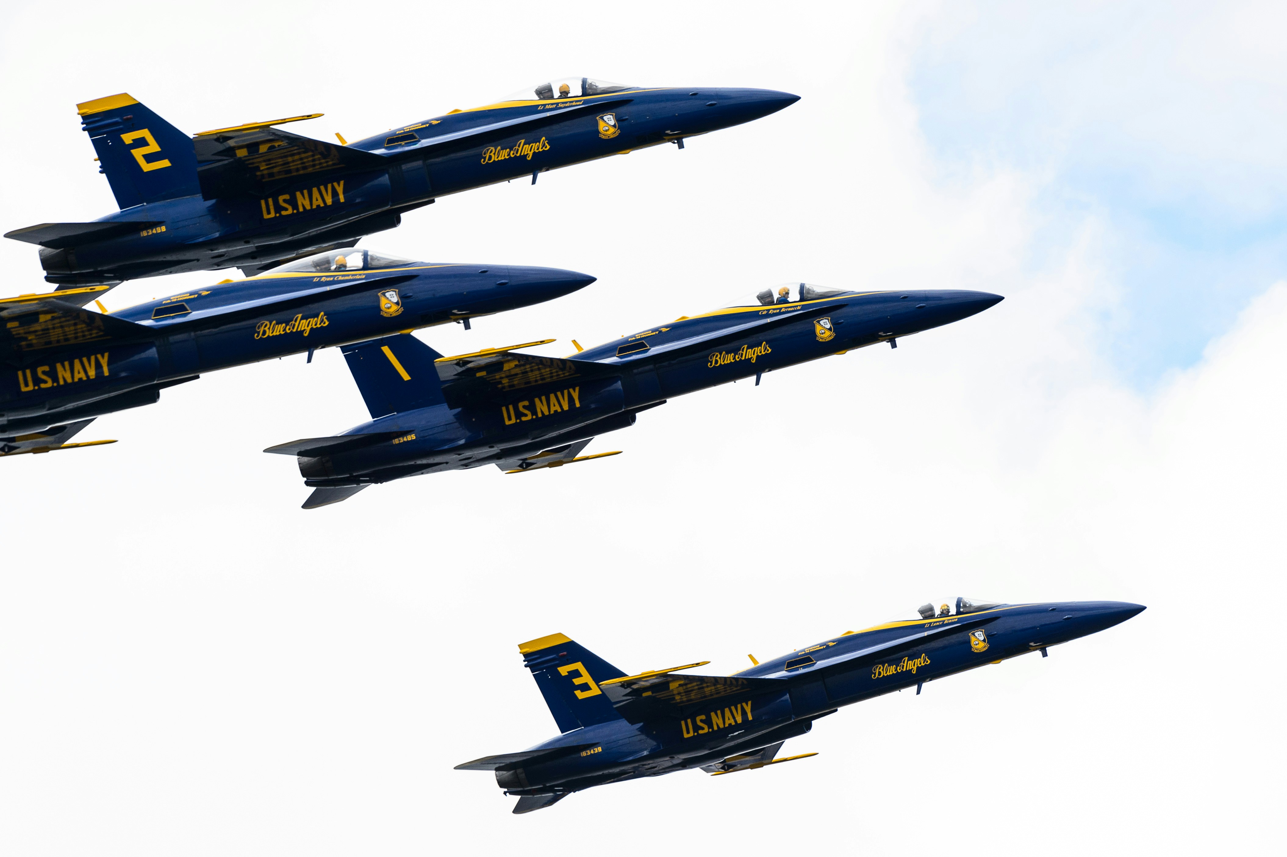 four blue planes flying through the sky, Great leadership requires great followership.  Look closely at all four pilots in this frame.  It must take incredible courage and trust to fly a powerful jet at high speeds while not even looking forward, but rather at the #1 leader whose actions determine what all the other pilots must do.