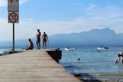 A group of anglers enjoying a sunny day by the lake.