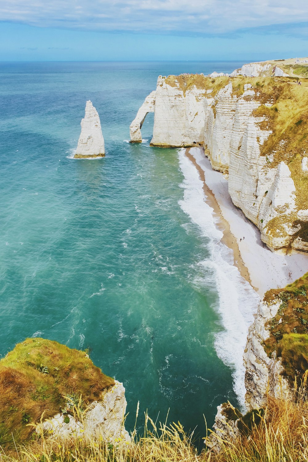 white cliff near body of water