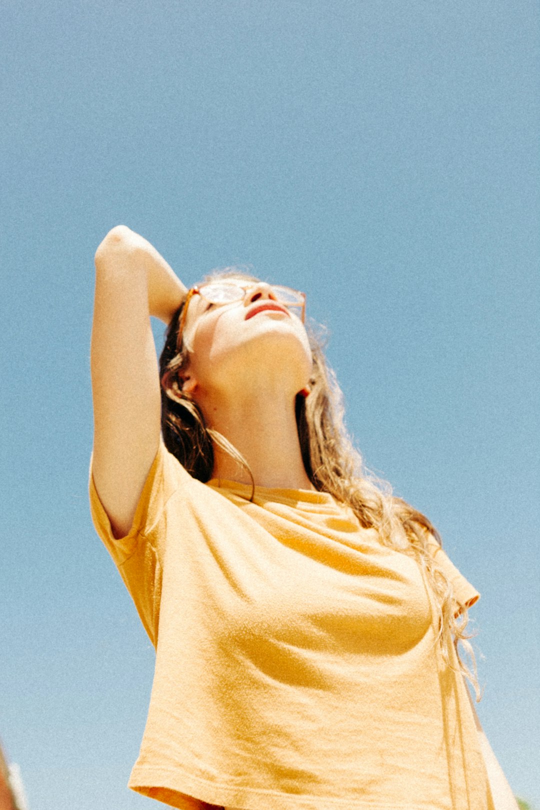 woman wearing yellow top during daytime