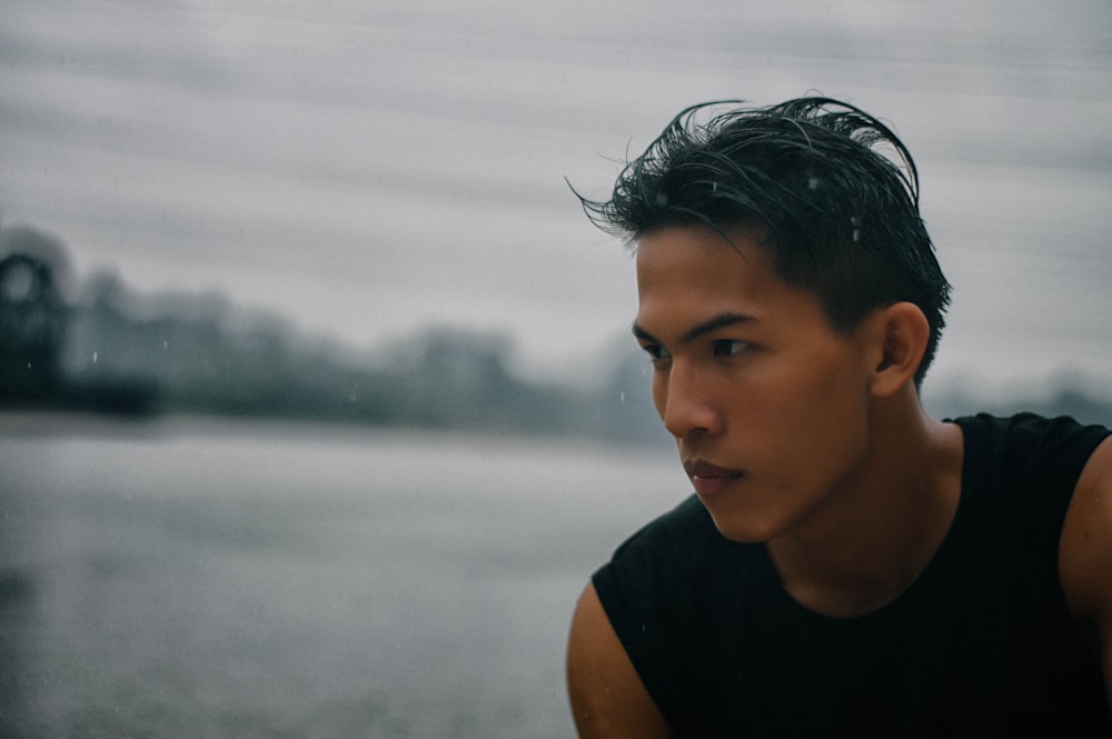 man in black tank top