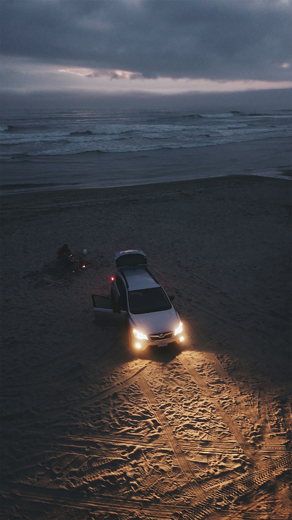 gray vehicle parked near shore line