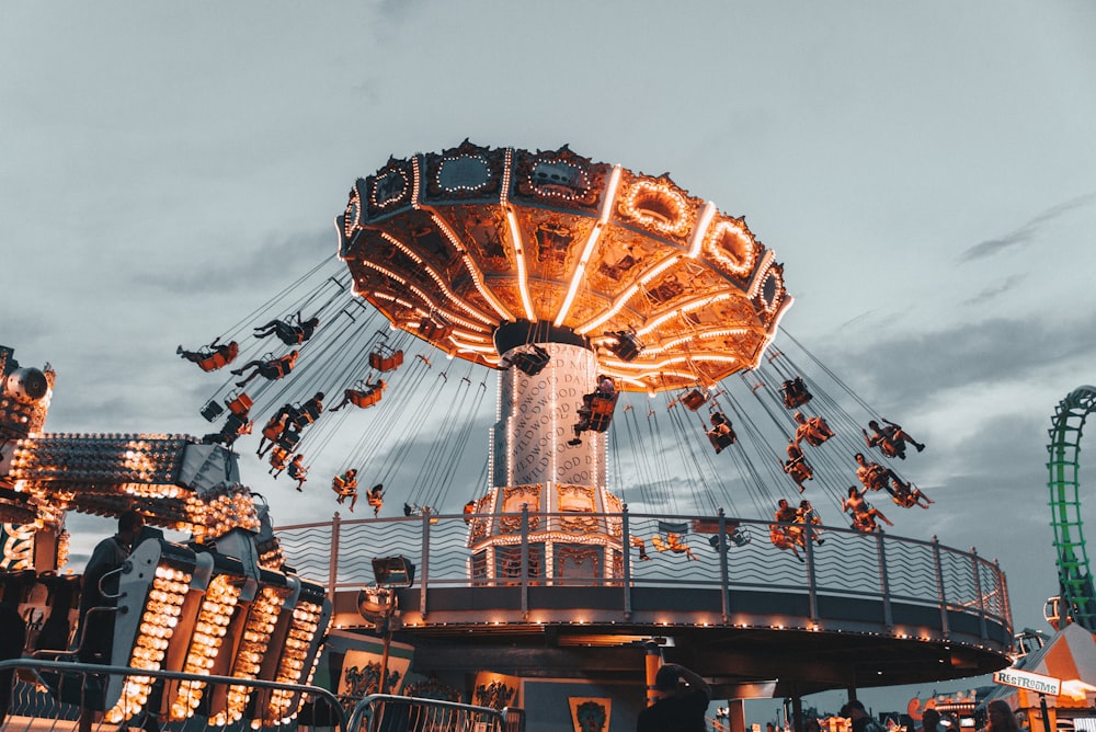 people riding amusement park ride