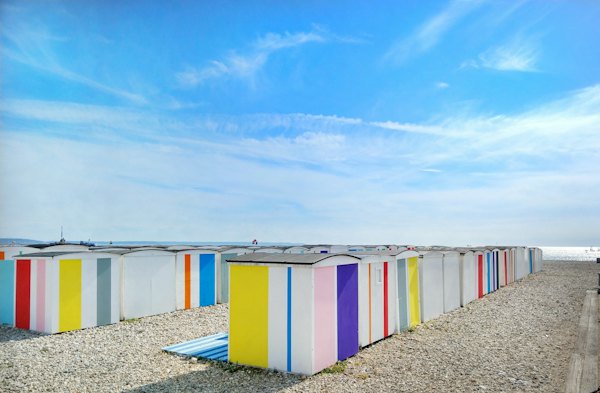 Painted beach huts on the shingle — Le Havre, France