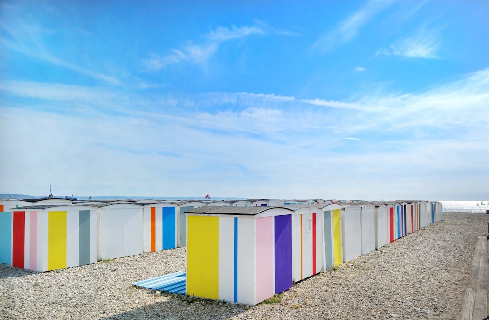 multicolored sheds near shore during day
