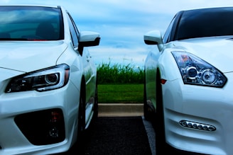 white Nissan GT-R and white Mitsubishi Lancer Evolution 10