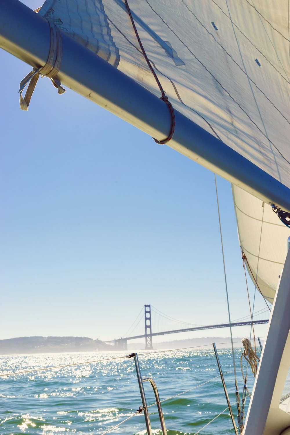 a view of the golden gate bridge from a sailboat