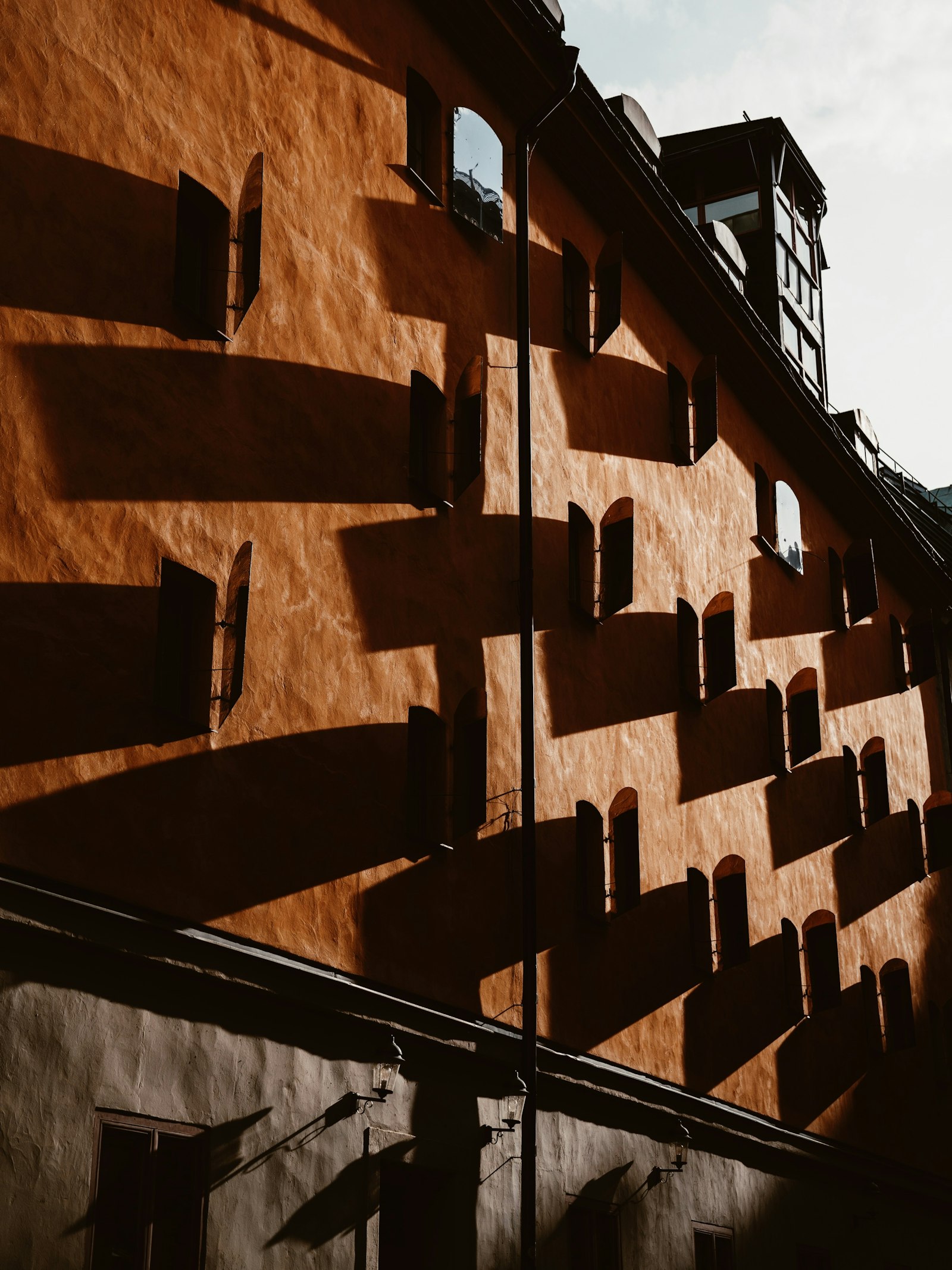 Sony a7R II + Sony FE 24-70mm F2.8 GM sample photo. Brown concrete building with photography