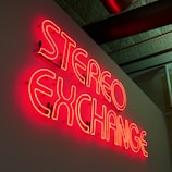 Stereo Exchange LED pub signage on white painted concrete wall
