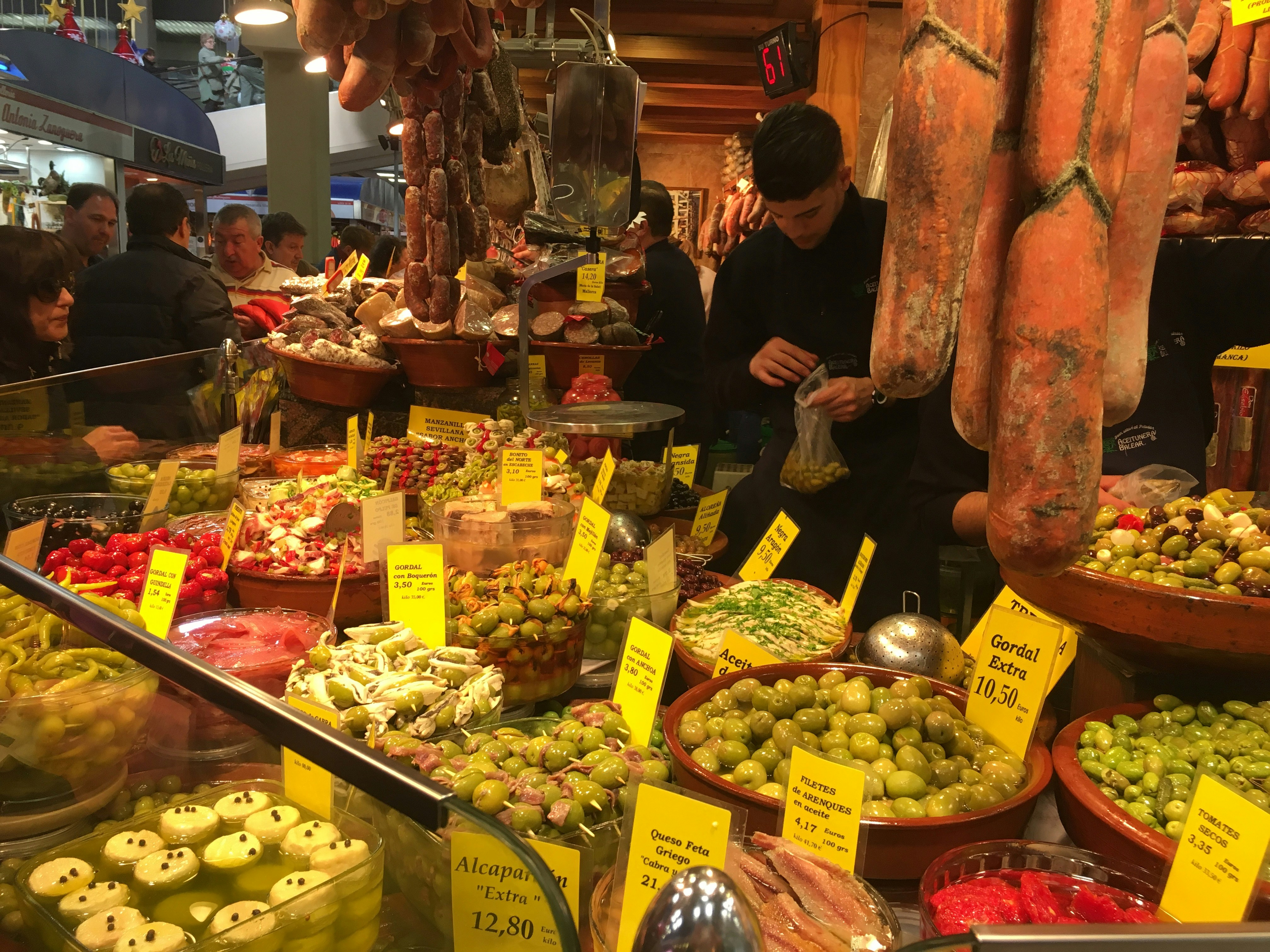 Colorful food market in a Mediterranean city with fresh produce and spices