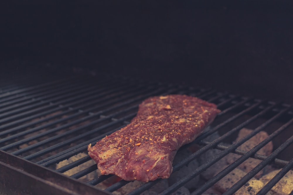 grilled meat on charcoal grill