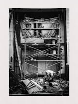 Photo of a construction site with workers collaborating on masonry work.