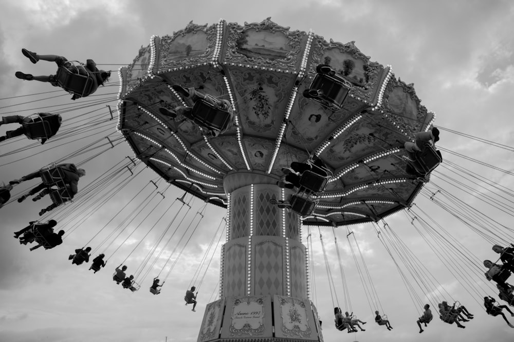 people on amusement park riding on ride