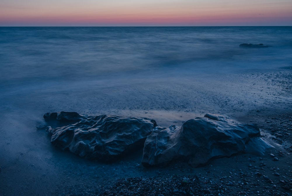 grey rock on sand