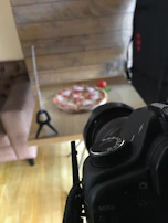 Behind-the-scenes photo of the Pomodoro team planning a social media campaign around a rustic wooden table.