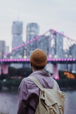 selective focus photography of man carrying bag
