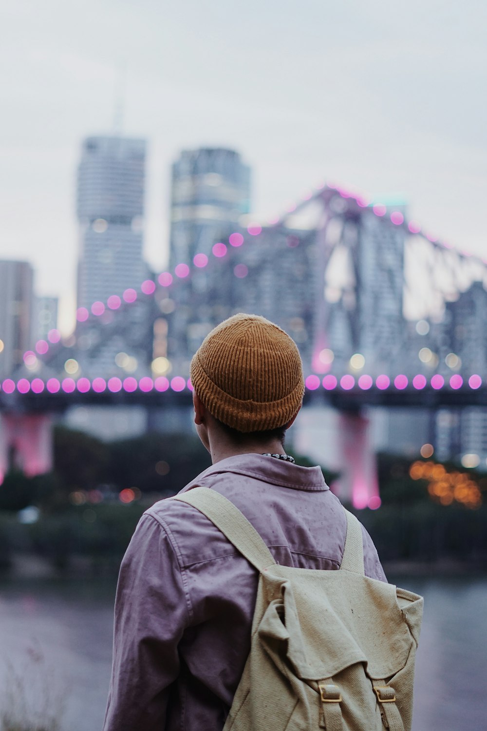 selective focus photography of man carrying bag