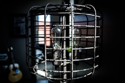 Decorative lamp shaped like a classic rock band microphone in a dim room.