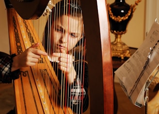 girl playing harp