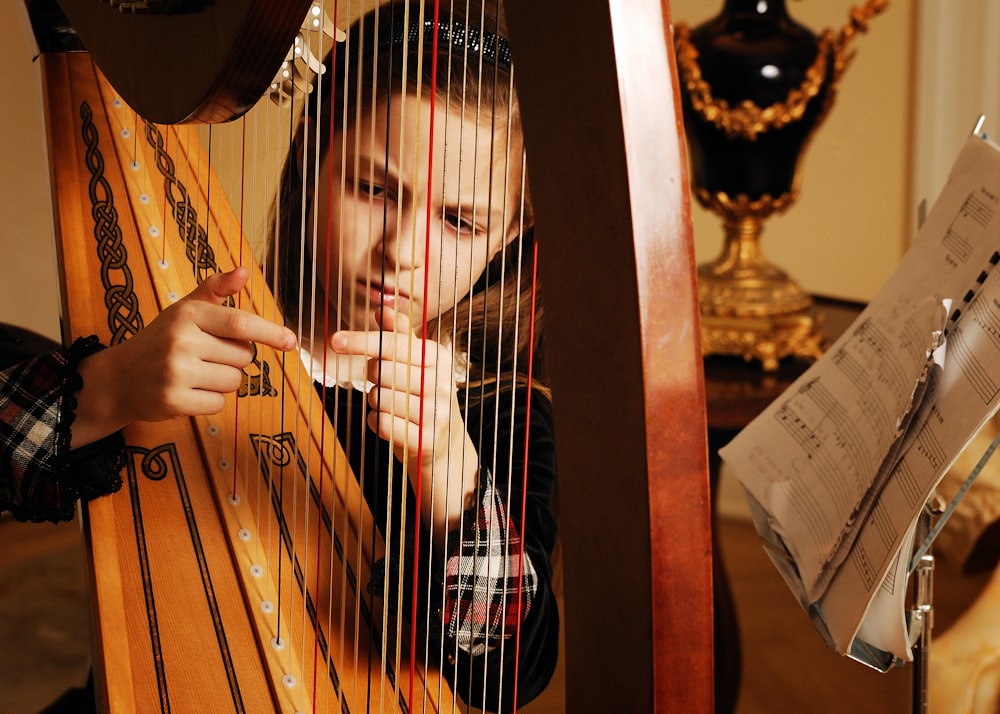 girl playing harp