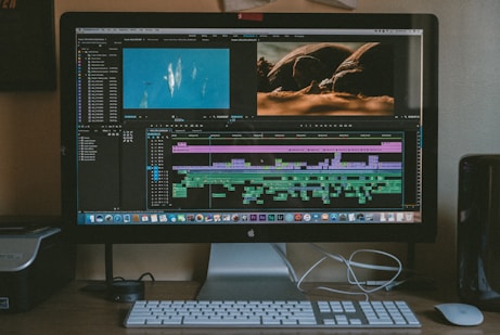 black iMac, Apple Magic Keyboard, and Apple Magic Mouse