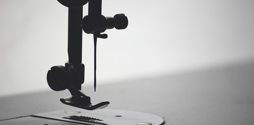 macro photography of sewing needle