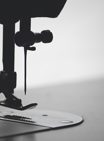 macro photography of sewing needle