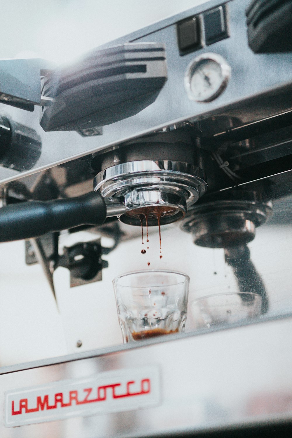 selective focus photo of espresso machine