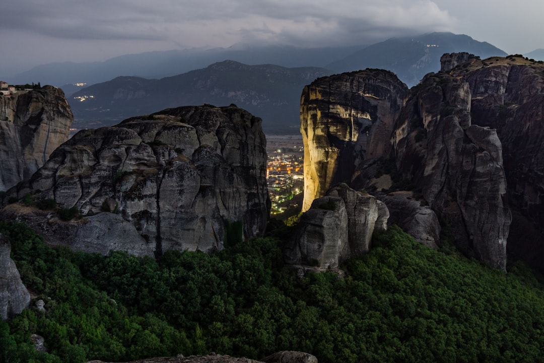 mountain photography, One of the last pictures in that amazing night in Meteora. The sunset didn’t offer as vivid color as I had hoped for, but the city light reflecting from the rocks added a soul and enigma to this breathtaking place.</p></figure><p>Meteora, Greece 2017