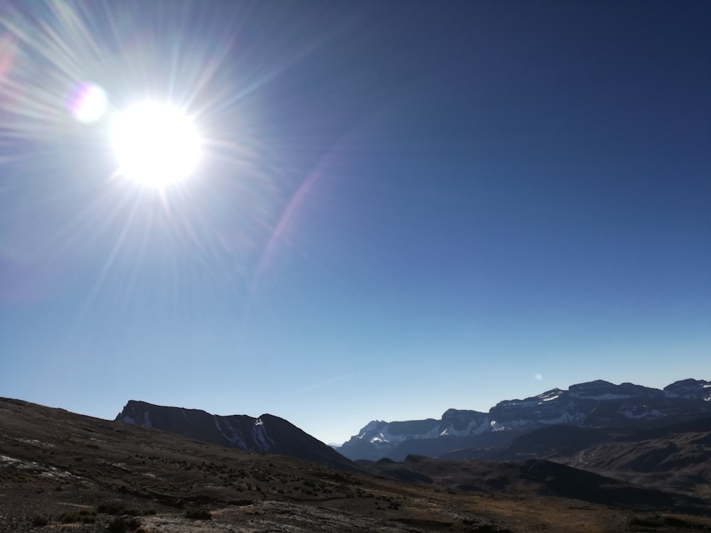 brown mountains under blue sky