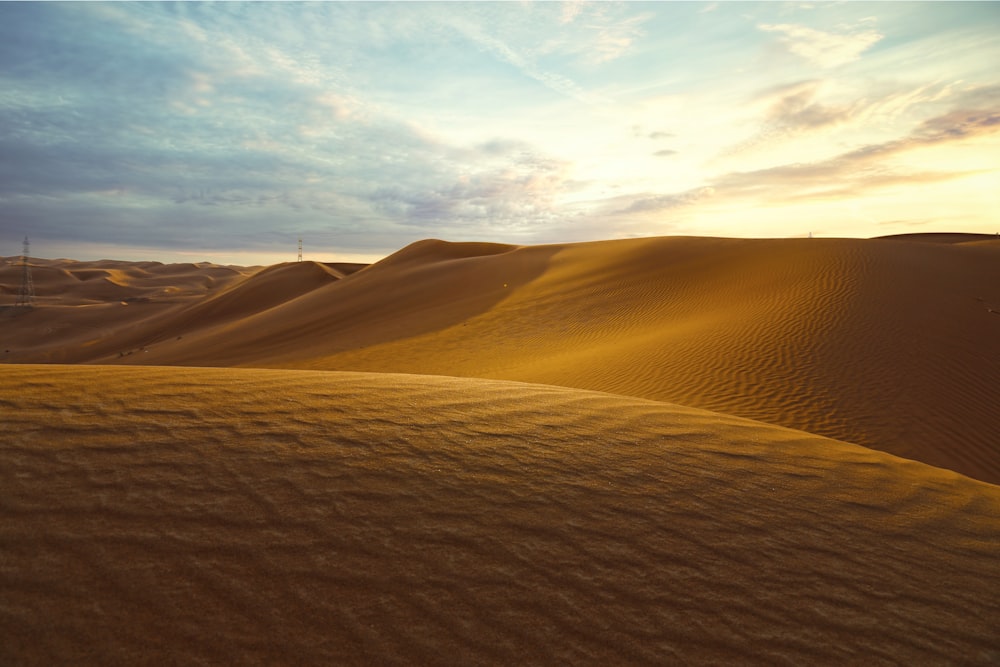 sand dunes during daytime