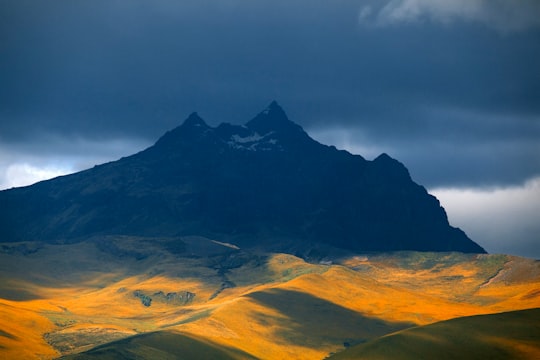 black mountain under gray clouds in Cotopaxi Province Ecuador