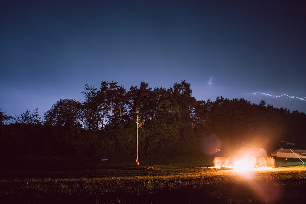 bright light by the house near the trees