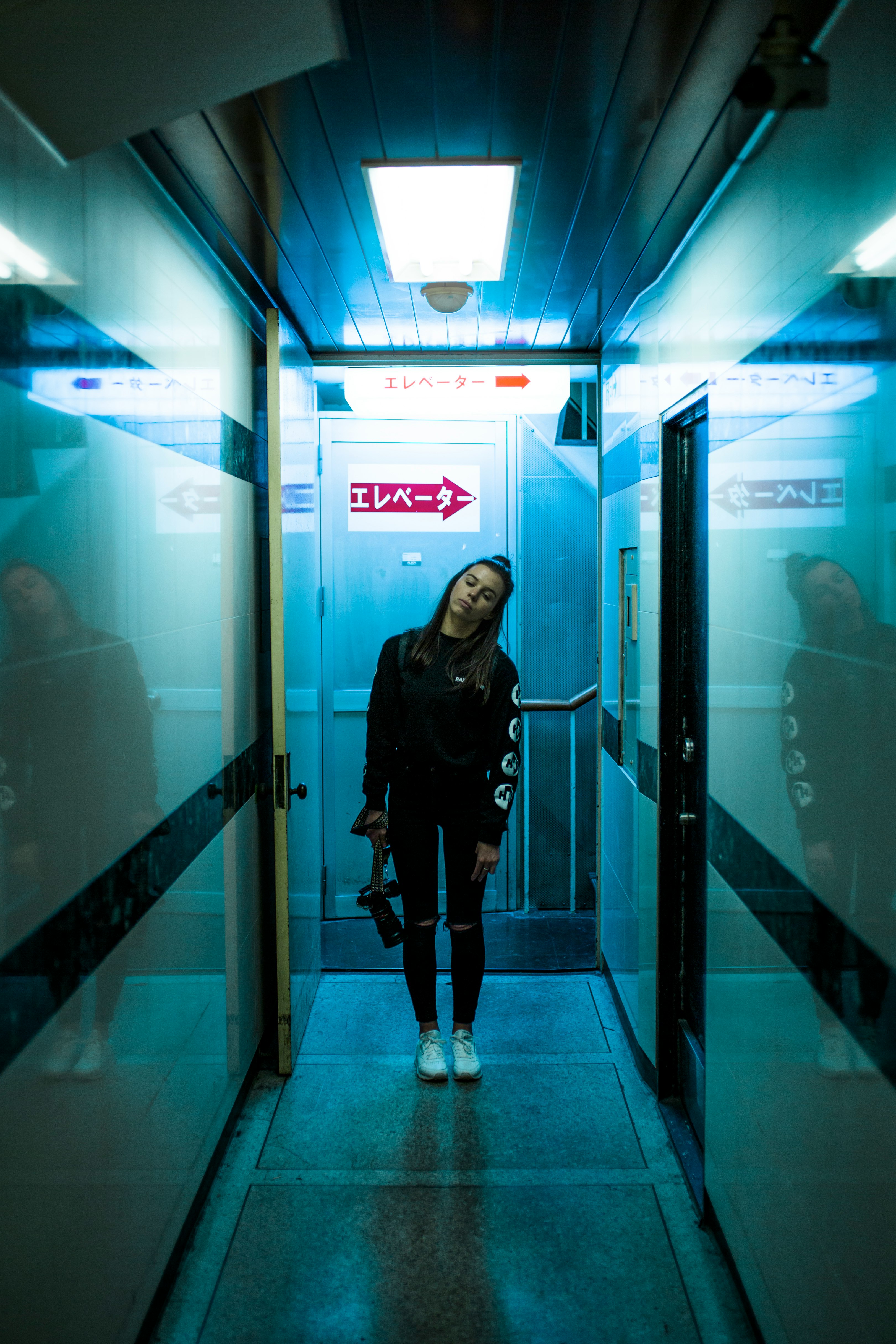woman standing in corridor