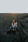 woman sitting on sand