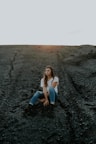 woman sitting on sand