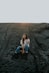 woman sitting on sand