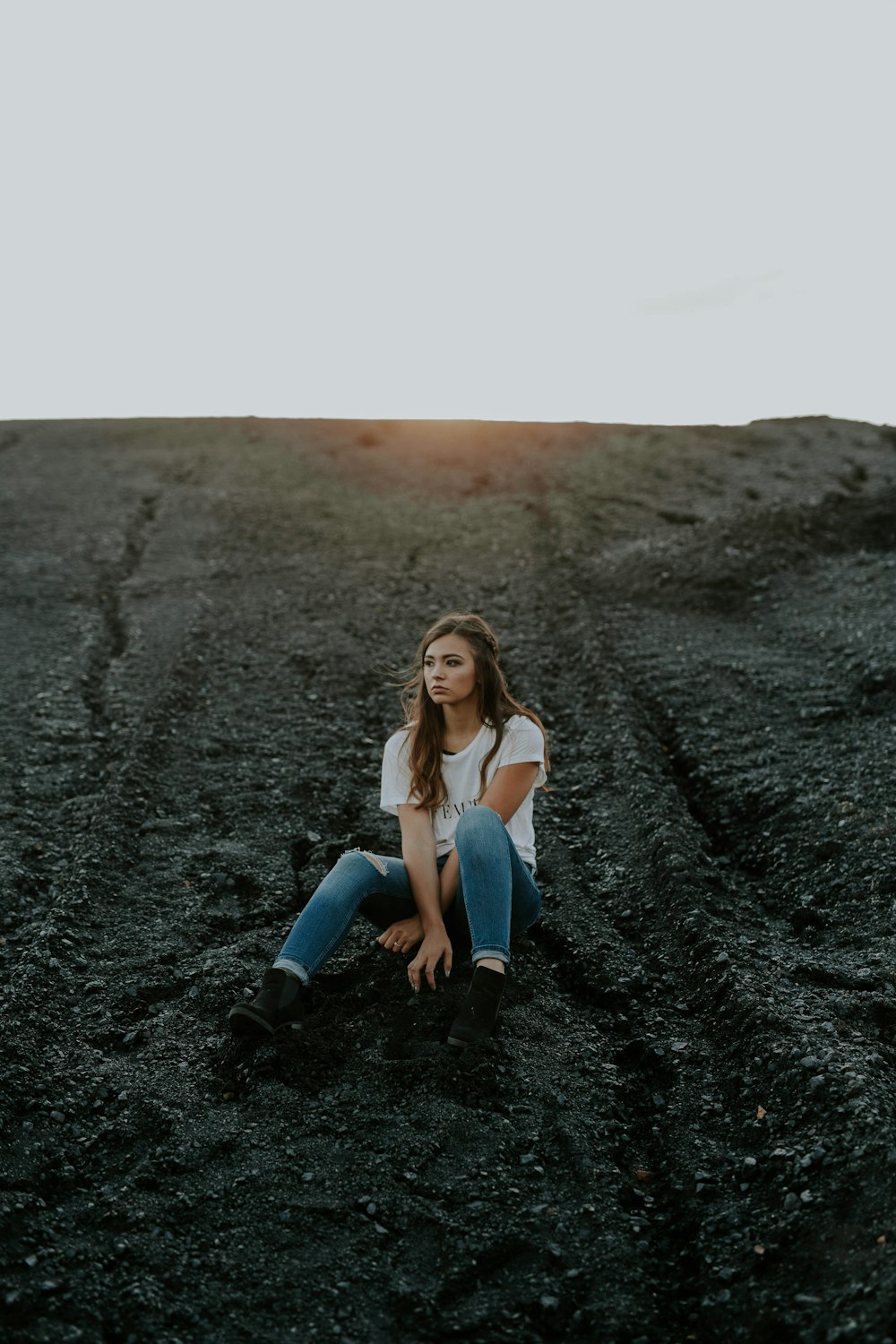 woman sitting on sand