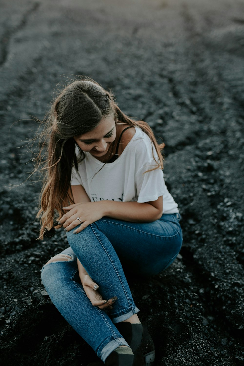 shallow focus photo of woman in whit scoop-ncek shirt