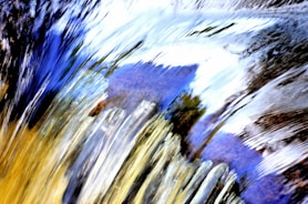 Abstract image blending scientific symbols with spiritual icons in blue and gold tones