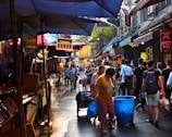A vibrant street market in Chaozhou bustling with locals and colorful stalls.