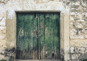 A weathered traditional Levantine door, representing stories passed through time.