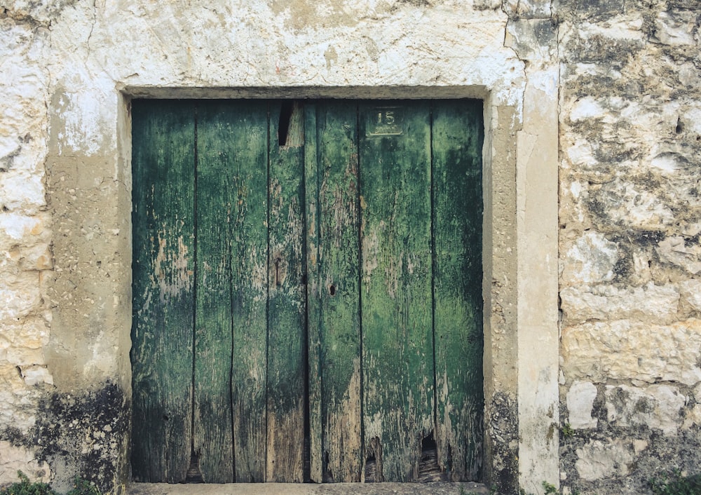 green wooden room door close