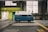 blue and white van inside yellow painted warehouse