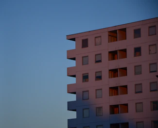 Minimalist high-end residential building exterior in Patrimônio do Carmo under soft natural light.