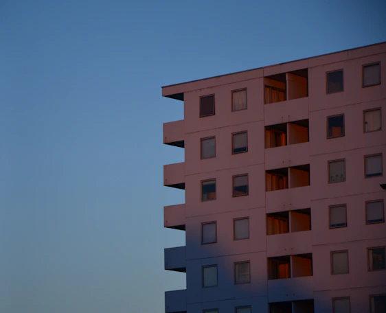 Minimalist high-end residential building exterior in Patrimônio do Carmo under soft natural light.