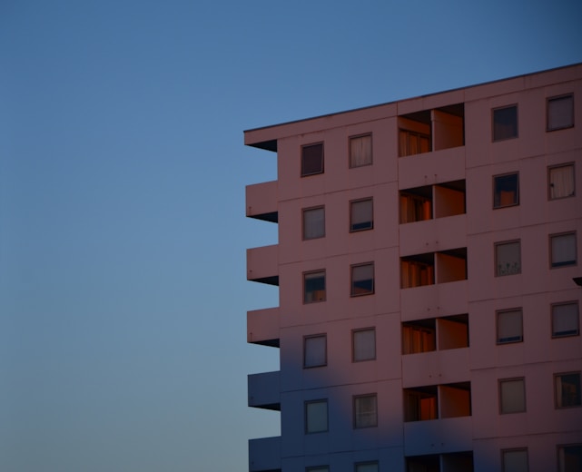A serene, minimalist residential building with clean lines and natural light in a peaceful Lima, New York setting