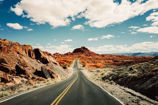 road under white and blue sky in Valley of Fire State Park United States