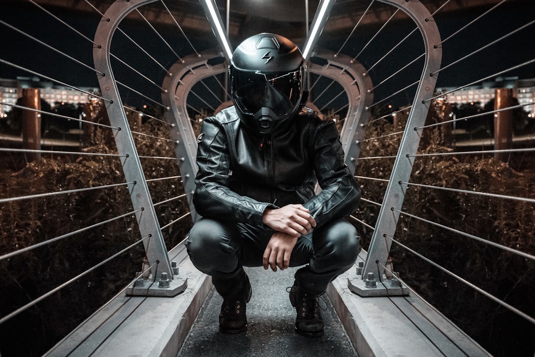 man in black full-face motorcycle helmet and jacket