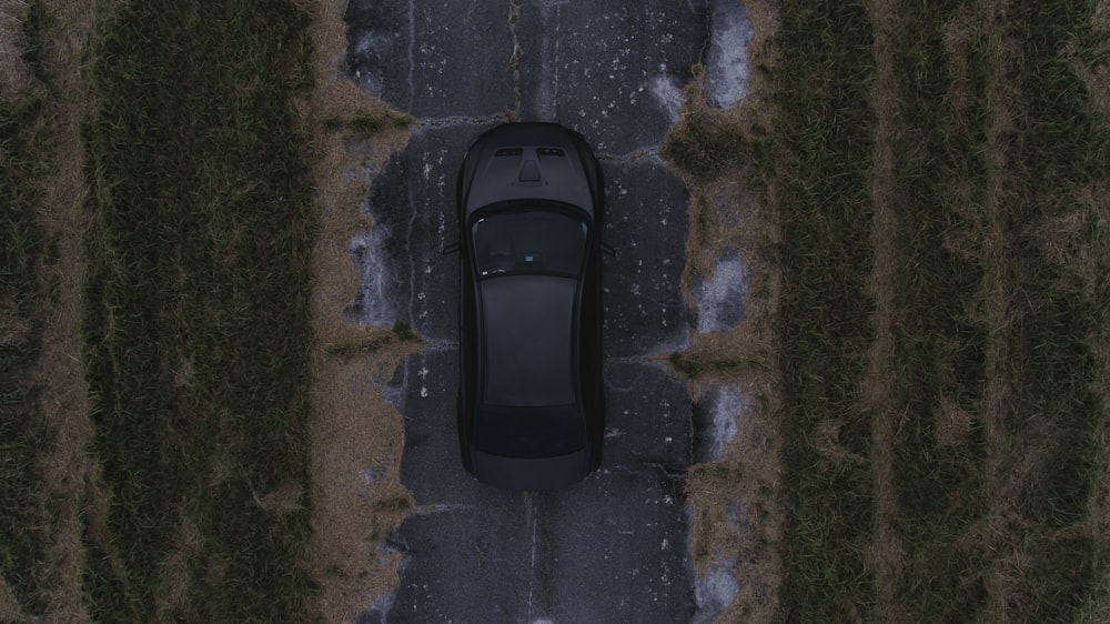 black vehicle running on road